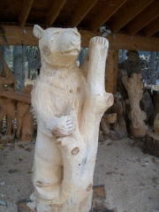 Bear holding a Stump